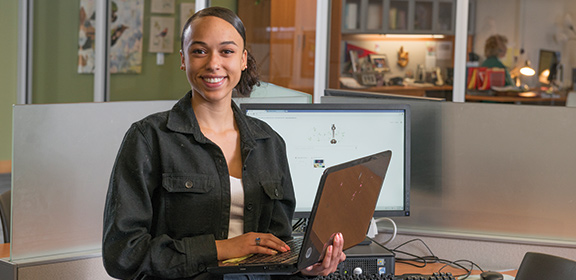 online construction management student on laptop