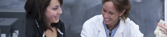 Student working with teacher