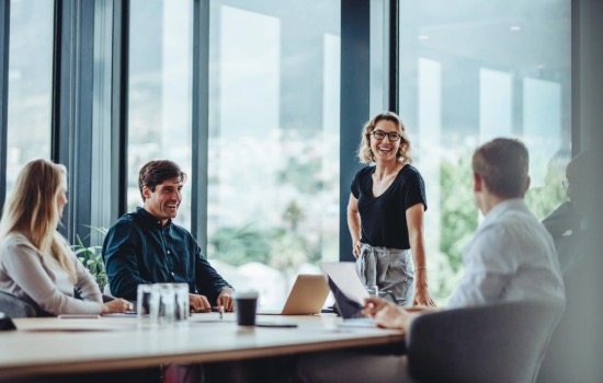 People smiling at desk