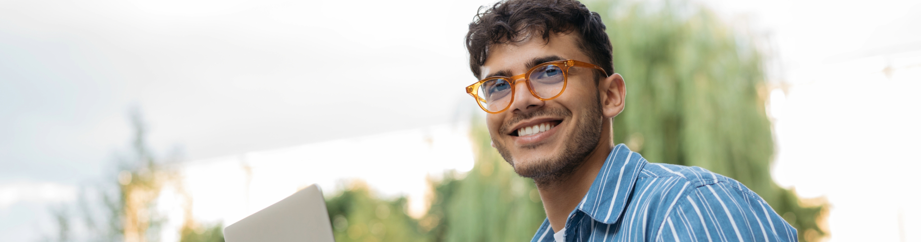 man smiling on the computer