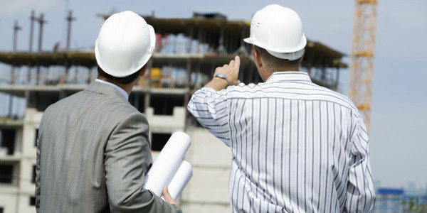 Construction workers planning outdoor project
