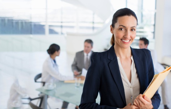 woman smiling with notebook