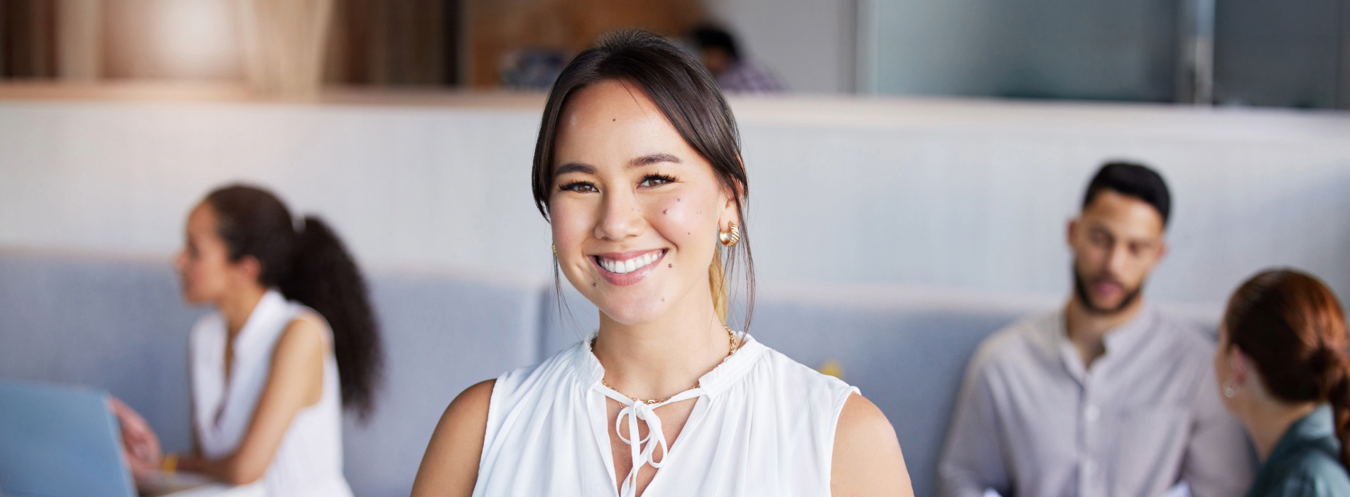 Woman smiling with a clipboard in her hand