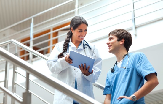 nurse educator smiling on stairs