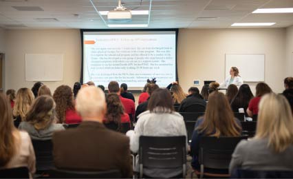 Faculty member giving presentation