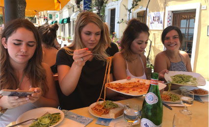 Students eating Italian food