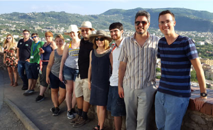 Professor with students in Italy